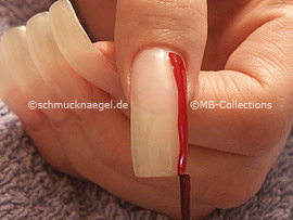 Nail lacquer in the colour dark-red